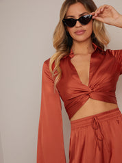 Long Sleeve V Neck Satin Twist Detail Top in Burnt Orange
