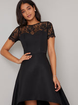 Short Sleeved Sheer Lace Dip Hem Midi Dress in Black