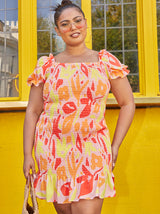 Plus Size Ruffle Shirred Abstract Print Mini Dress in Orange
